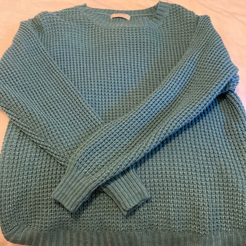 Teal sweater.